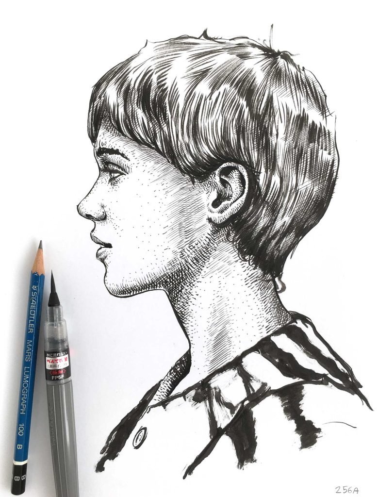 Ink portrait drawing for sale by Dario Moschetta – side profile artwork with pen and pencil beside the drawing on white paper