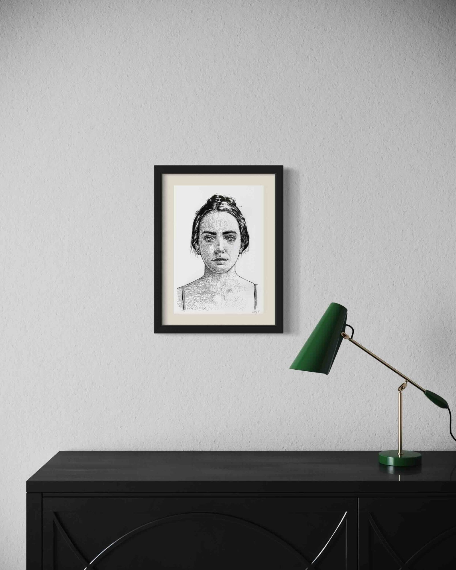 Minimal black and white ink portrait by Dario Moschetta in a contemporary room