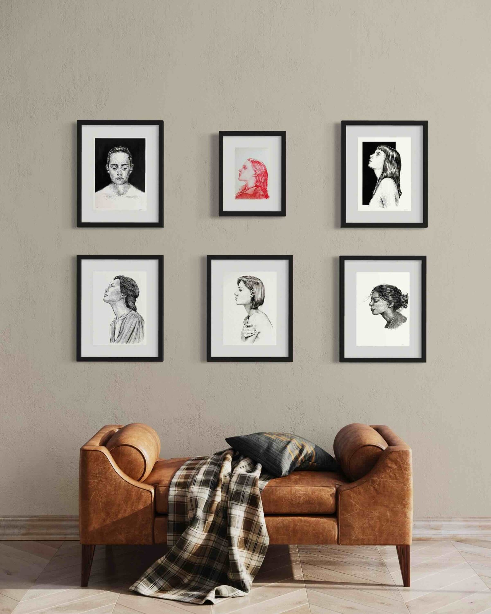 Ink portrait gallery wall by Dario Moschetta, displayed in a contemporary setting