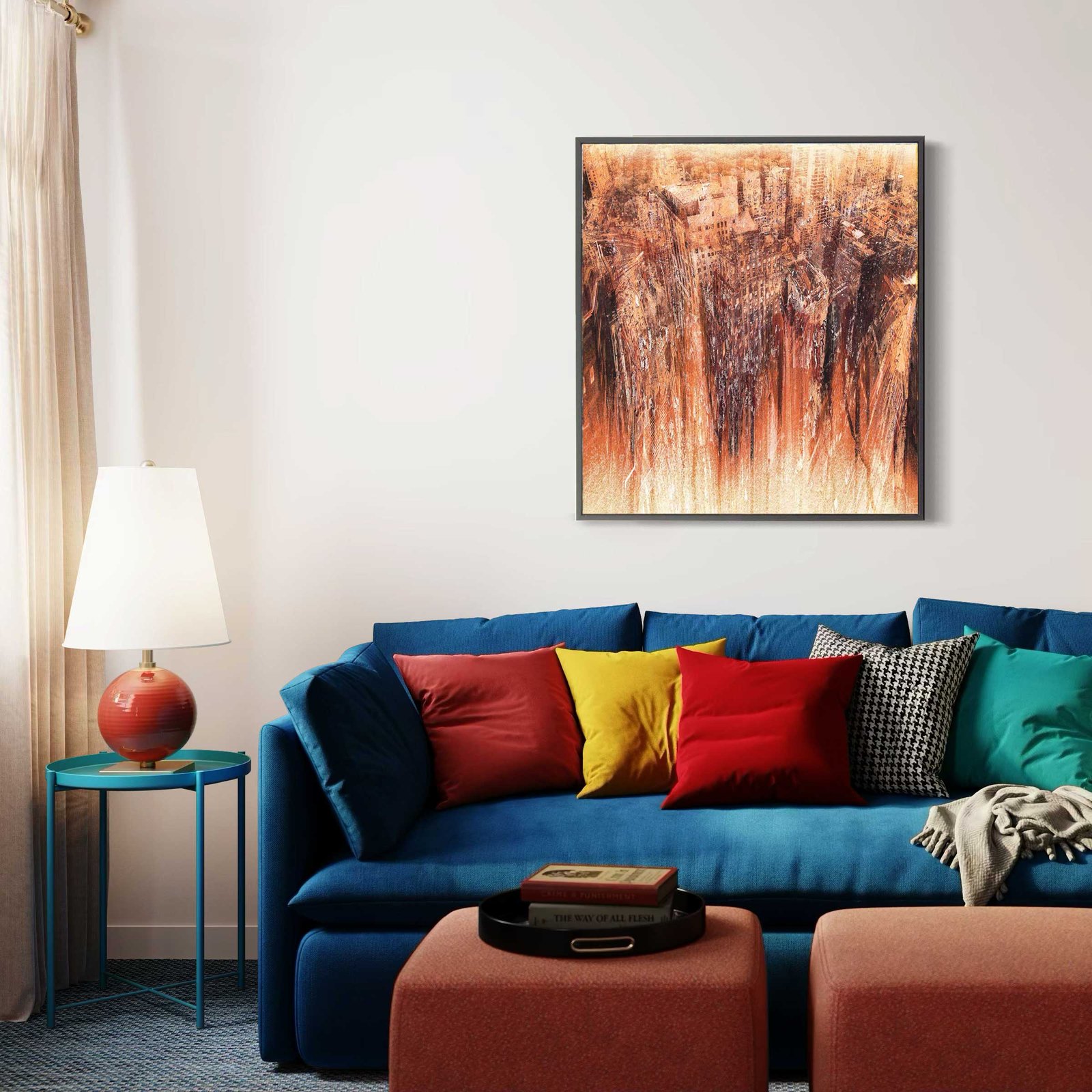 Orange-toned cityscape artwork by Dario Moschetta above a colorful sofa.