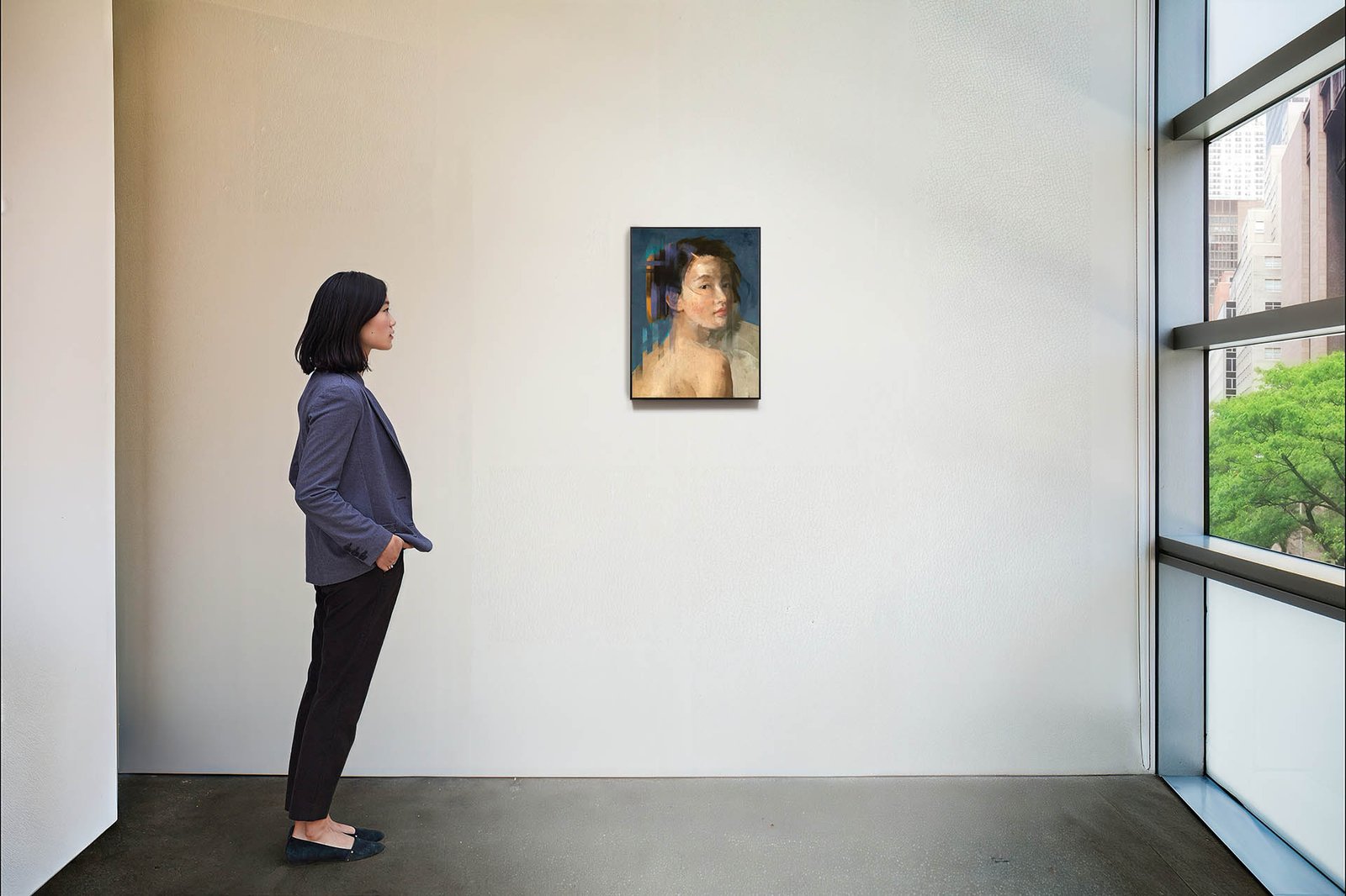 Mixed media portrait of a woman with blue background, shown in a gallery setting.