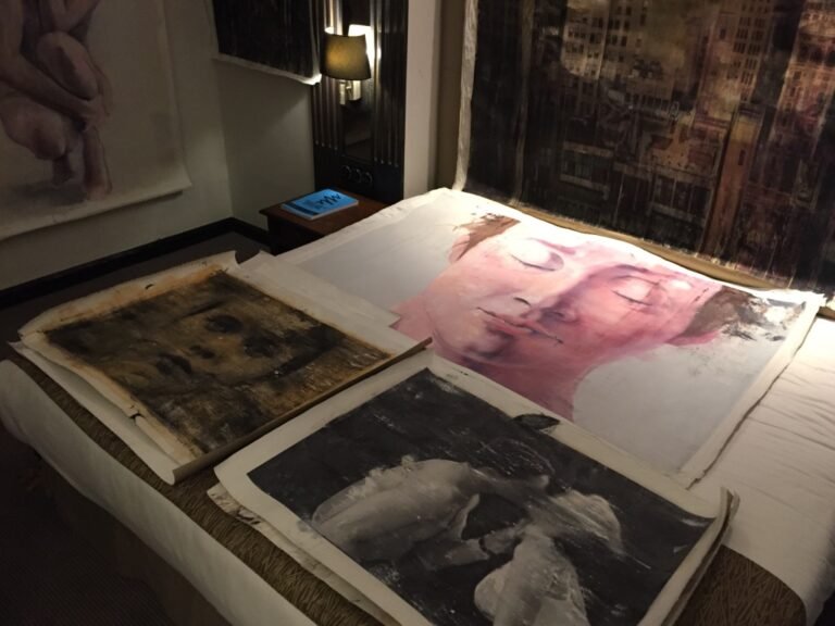 Canvases laid out on the bed of the hotel room, Artrooms London 2017