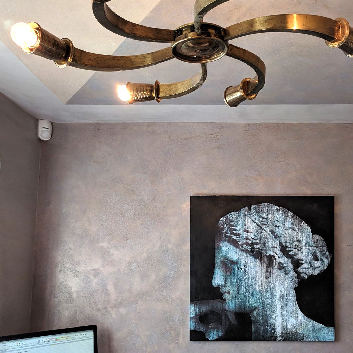 Blue classical bust artwork by Dario Moschetta installed in office space