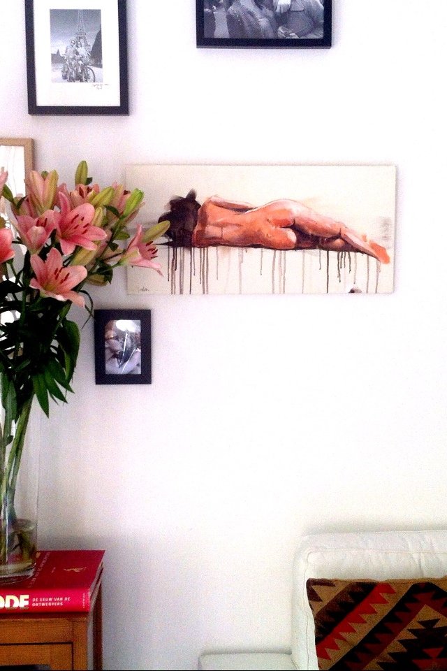 Reclining female nude painting by Dario Moschetta installed in living room