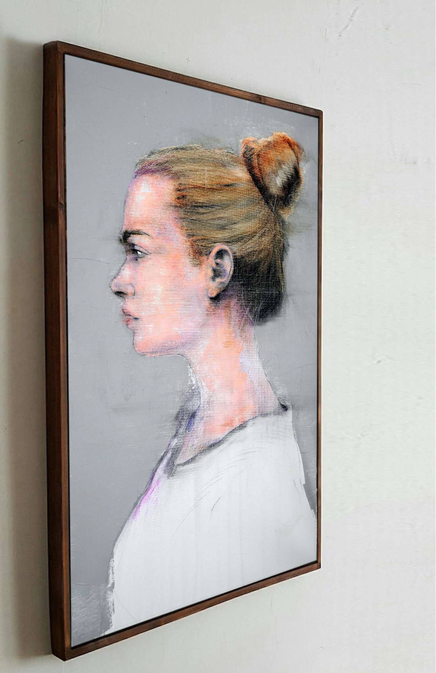 Framed female profile portrait artwork by Dario Moschetta displayed in a collector’s house
