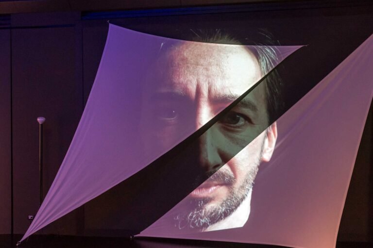 Video projection of a portrait, part of the Torre Velasca exhibition 2016