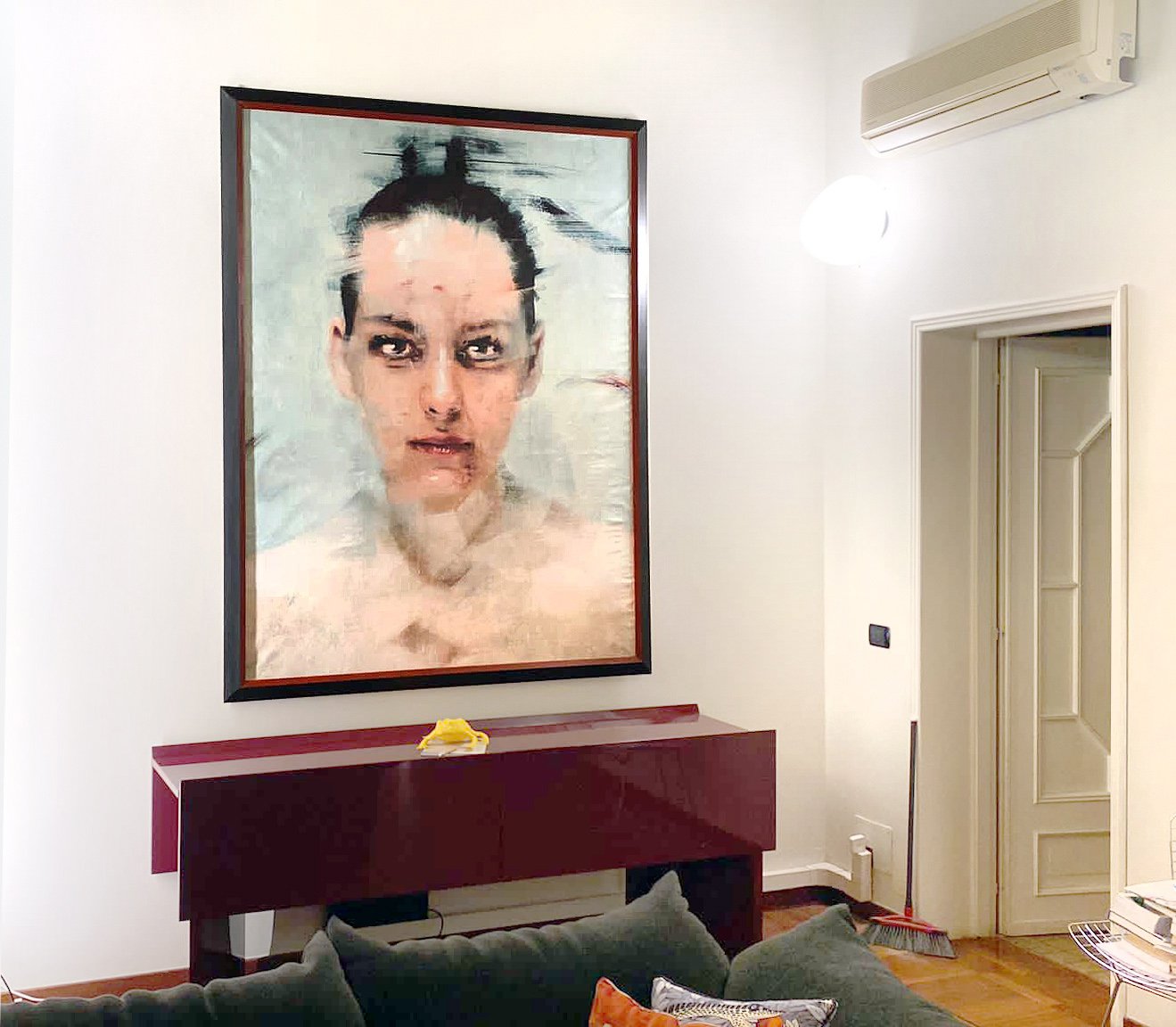 Contemporary female portrait painting by Italian artist Dario Moschetta installed in a private home interior
