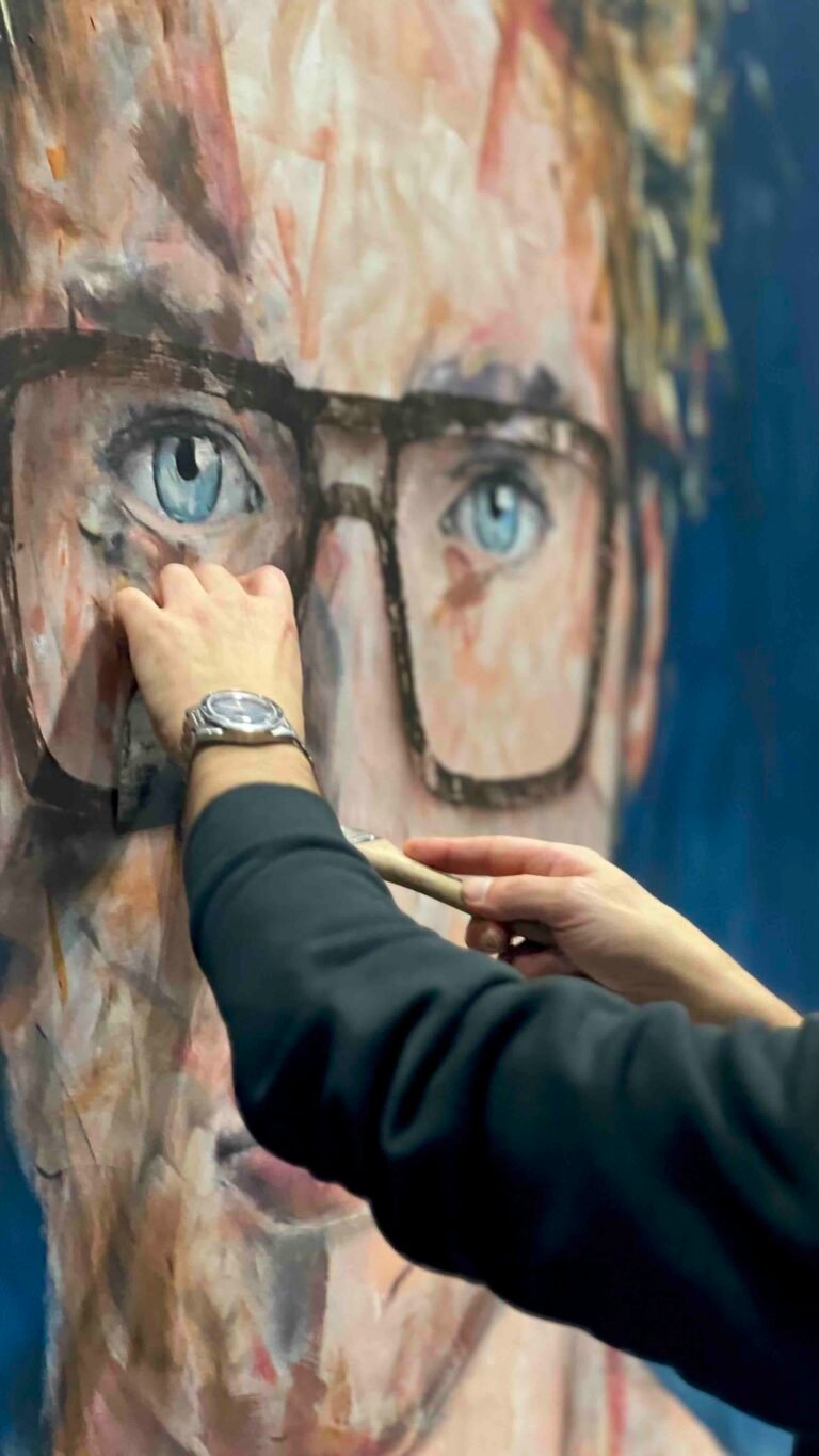Painting the frames of the glasses during the live session, MIDO 2025