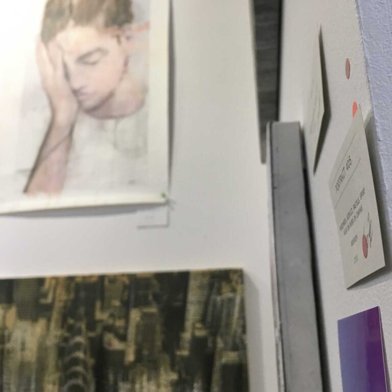 Female portrait hung above a cityscape at the booth, The Other Art Fair London 2019