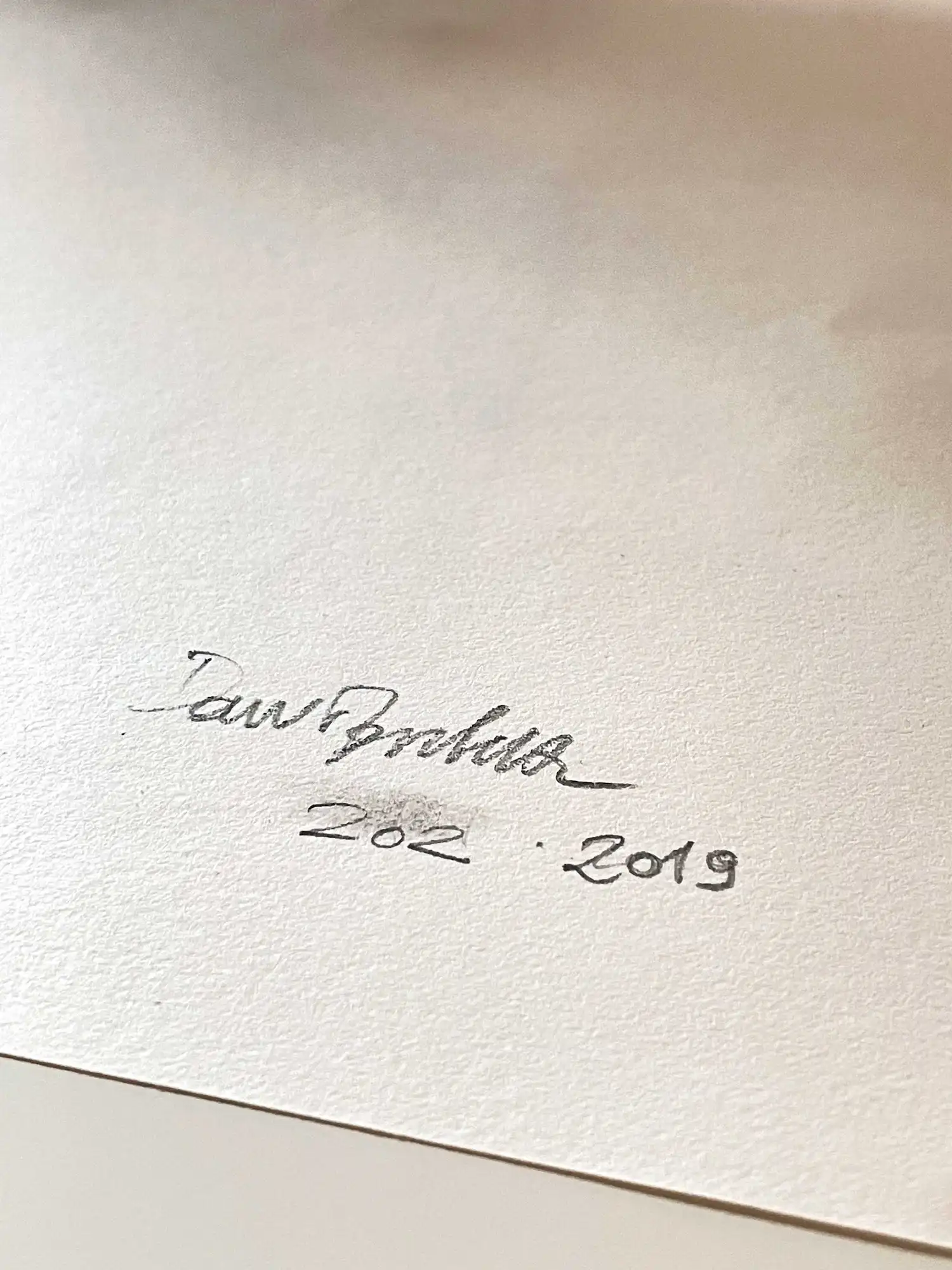 Artist signature on the back on blue ballpoint portrait drawing by Dario Moschetta