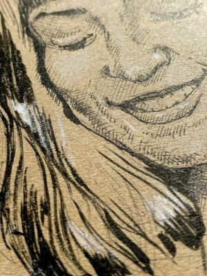 Detail of face from contemporary female nude drawing in ink and pastel on brown