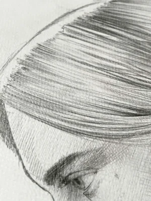 close-up of graphite portrait drawing for sale showing fine pencil shading on face and profile details