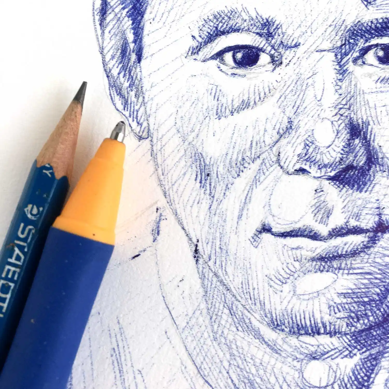Male portrait drawing in blue ballpoint pen with fine crosshatching technique
