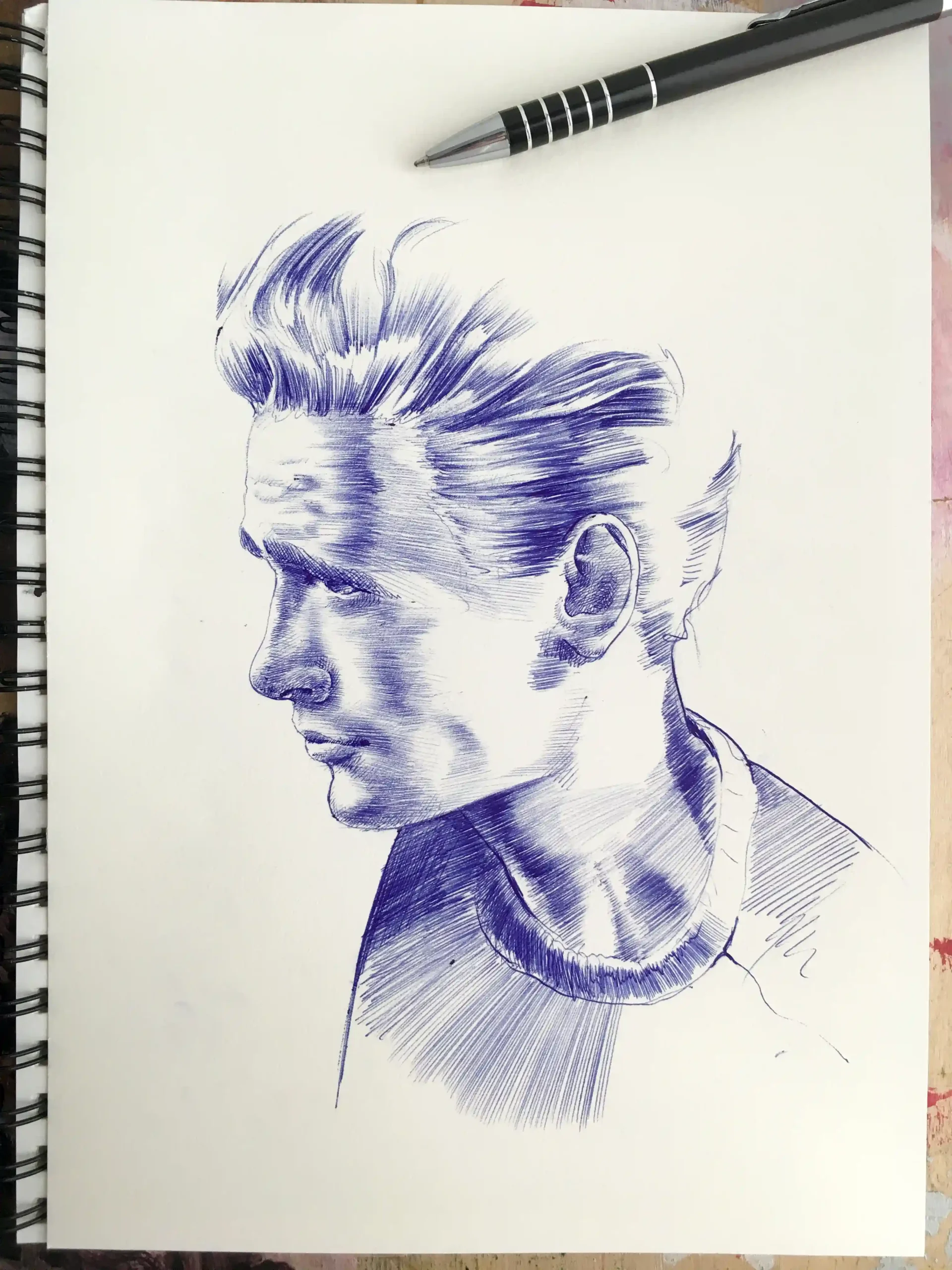 ballpoint pen drawing process – blue ink portrait on paper by Dario Moschetta