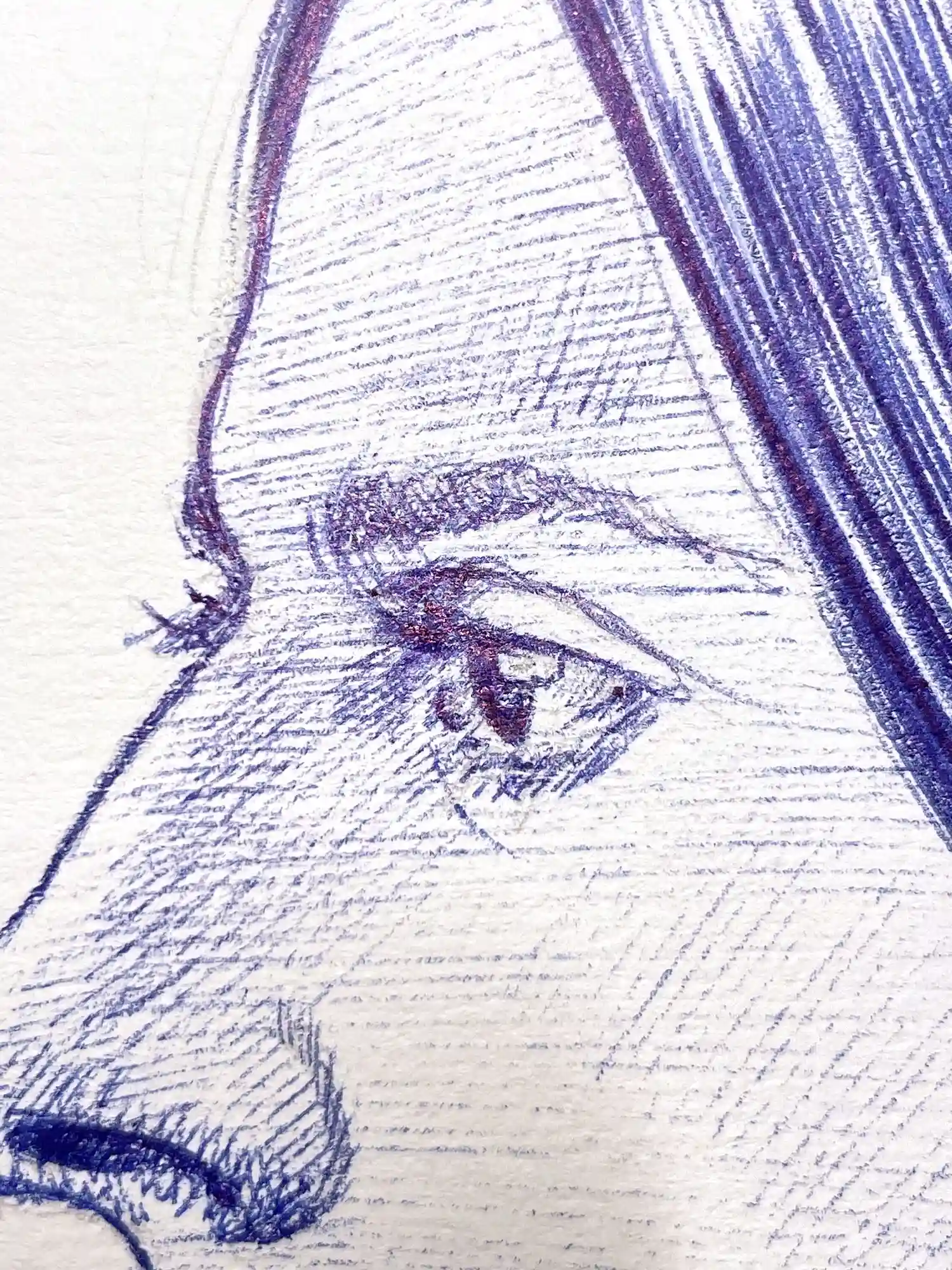Close-up of the eye in a female portrait drawn with blue ballpoint pen on paper