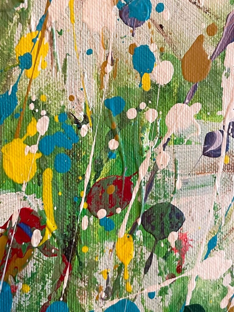 Close-up detail of Natural Collision with green, yellow, and white paint accumulation