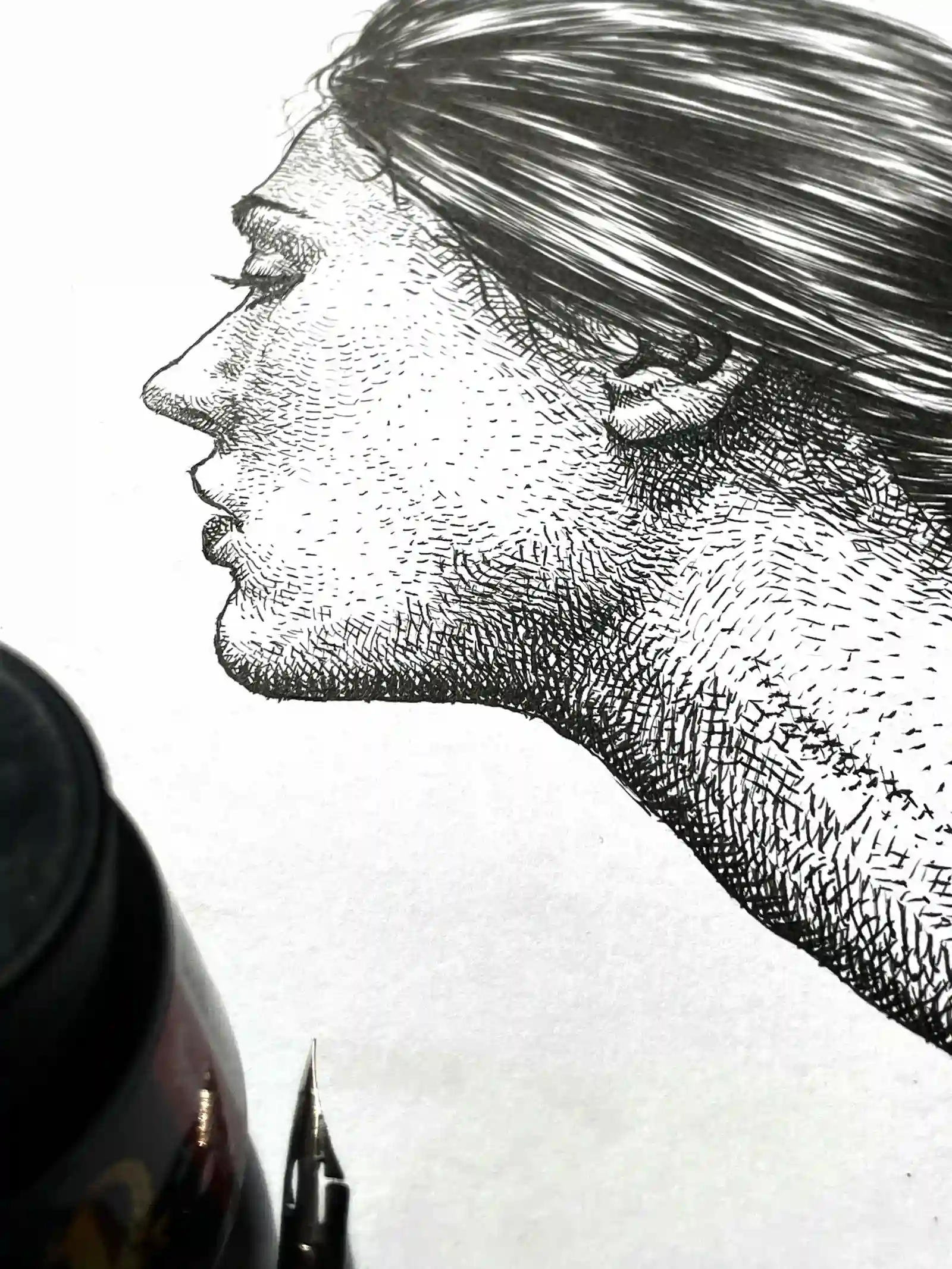 Female profile portrait ink drawing on paper with detailed shading and realistic features