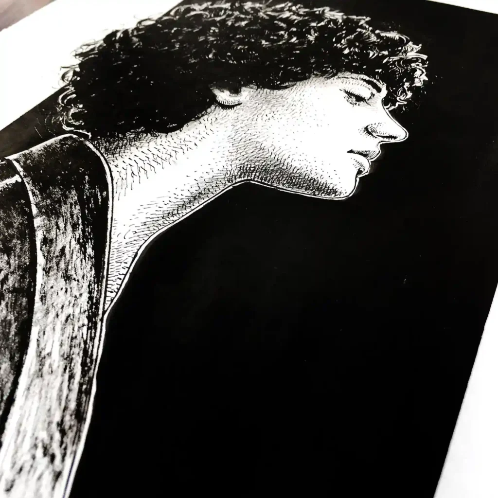 Side view of original female profile ink drawing on paper with strong black background