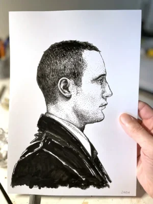 Male profile ink drawing held by the artist – Portrait 260A