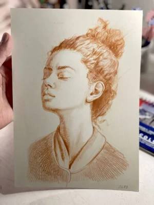 Sanguine portrait drawing held by the artist – Portrait 248B