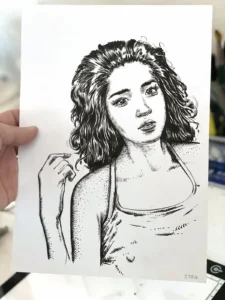Original black and white ink drawing of a woman held in the artist's hand — Dario Moschetta, ref. 258A