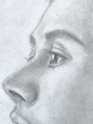 Close-up of graphite subtraction technique on eye and nose — pencil portrait drawing by Dario Moschetta
